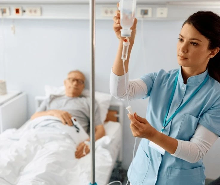 Robotic surgical arms over an operating table